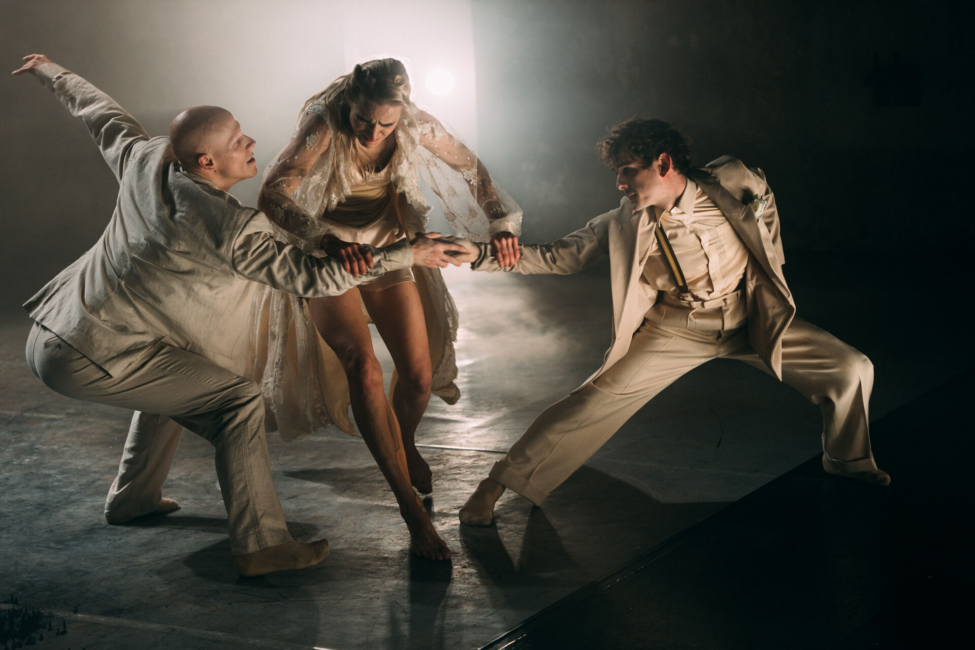A dancer’s form against a mysterious backdrop her body suggesting an private moment